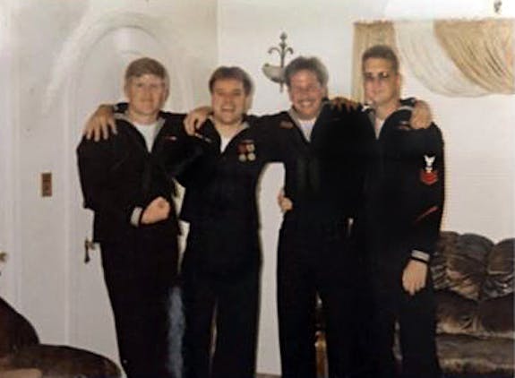 Eric second from right with his military friends