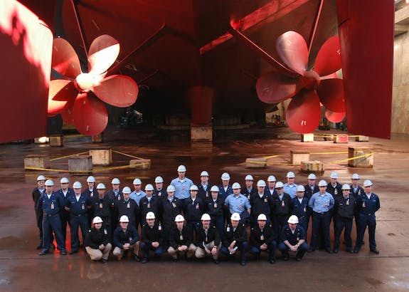 Mary Schwem front left USS Lincoln in drydock