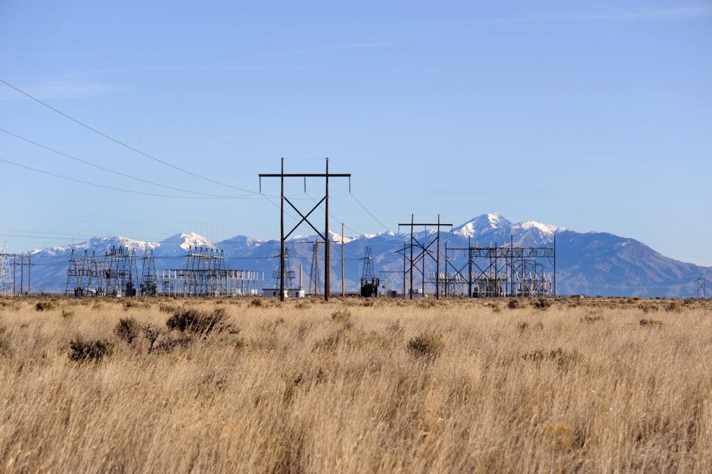 power station and electric towers in the desert