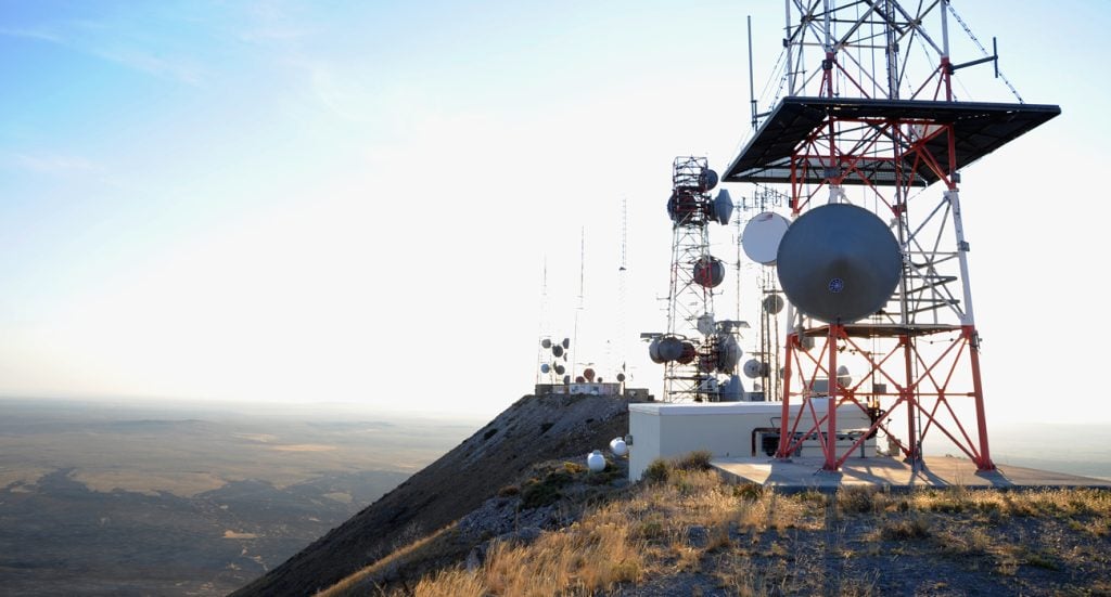 wireless communications towers on a hilltop