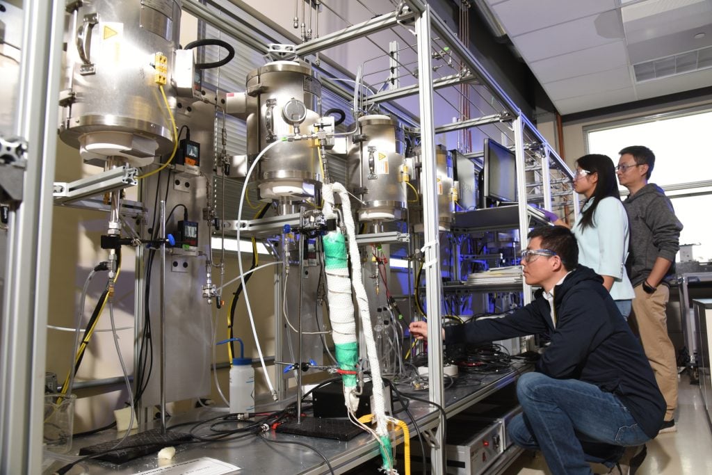 scientists inside the Electrochemical Processing and Electrocatalysis Lab