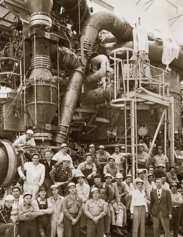 Aircraft Nuclear Propulsion crew poses in front of Heat Transfer Reactor Experiment No. 1