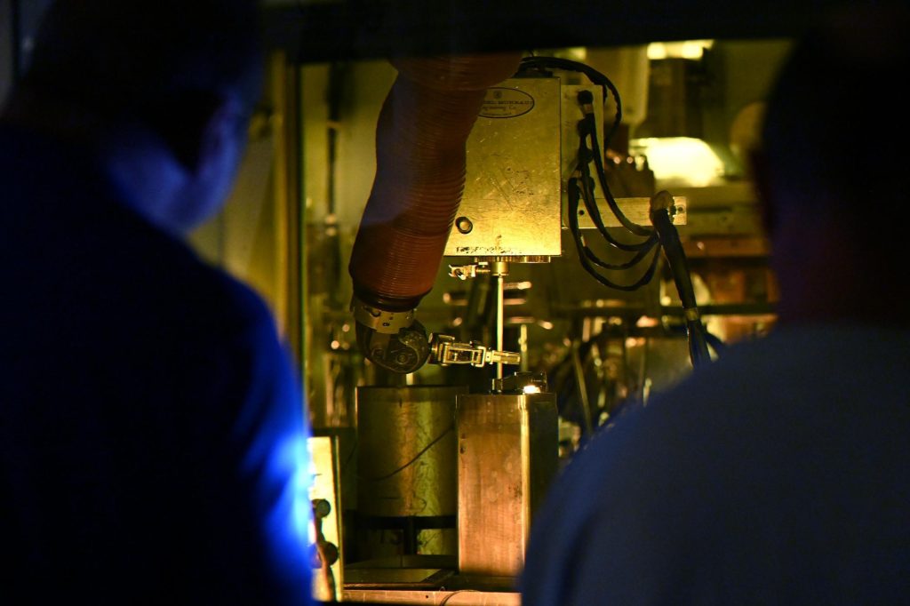 Byron commercial nuclear fuel rods being unloaded from cask inside HFEF hot cell