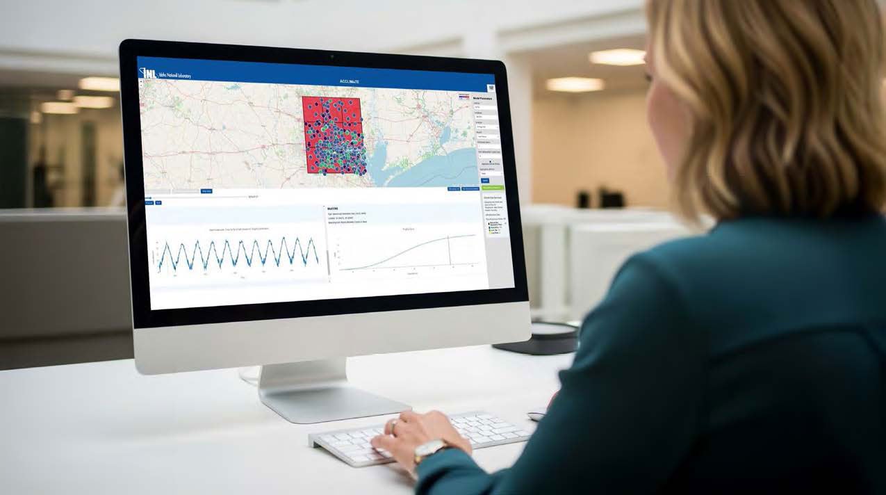Person viewing a data dashboard with maps and charts on a desktop computer.