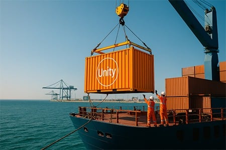 Utility container being lifted off a ship in the water