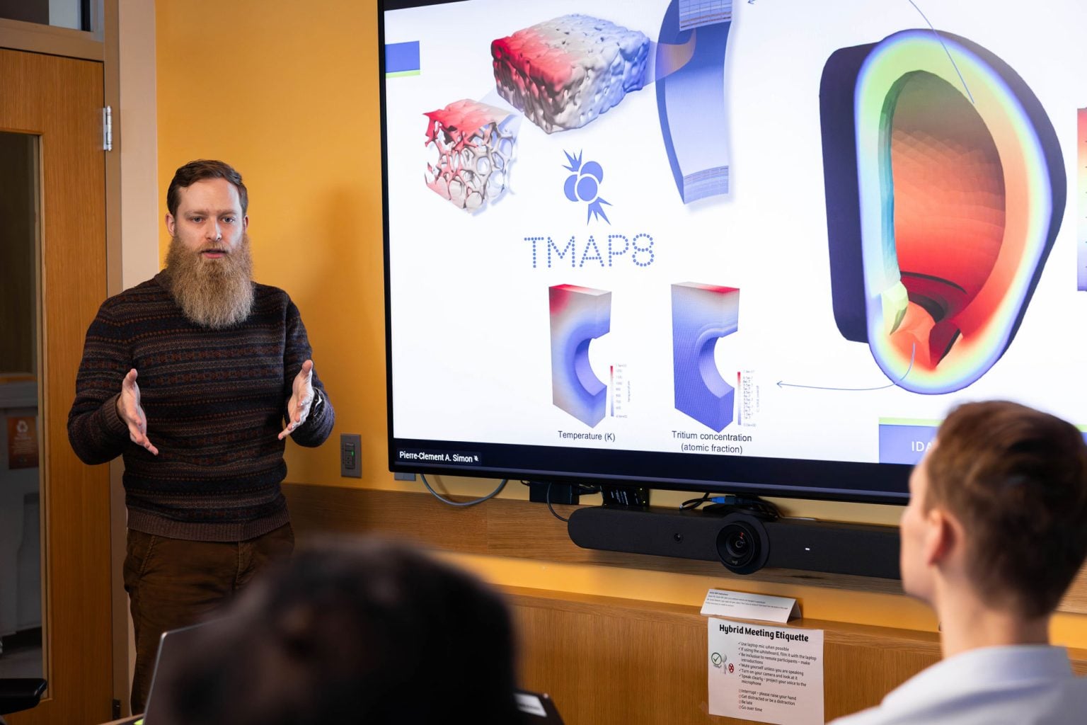 Pierre-Clement Simon talking to group of people about TMAP8