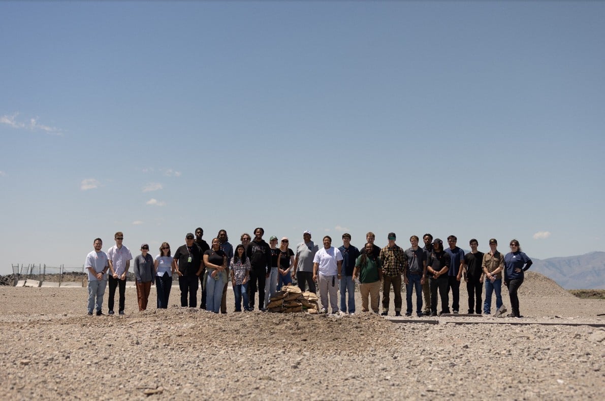 Interns line up for a photo in the Idaho desert. 