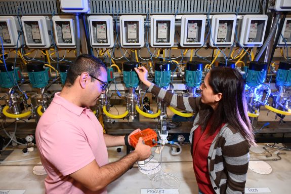 Luis Ocampo Giraldo (left) and Edna Cárdenas (right) use a multi-sensor system for monitoring solvent extraction equipment for their LDRD project, which could enhance safeguarding of special nuclear materials.